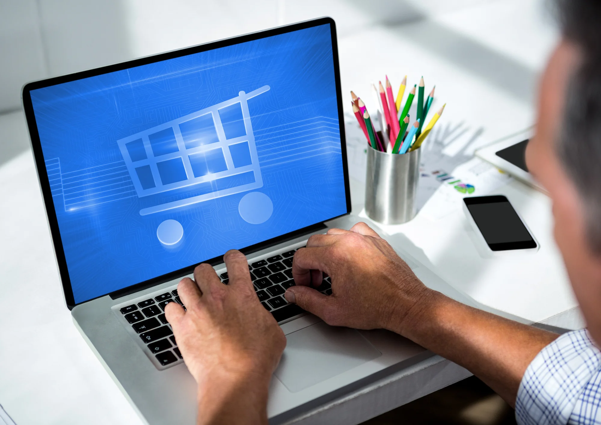 A person setting up an online store on a laptop